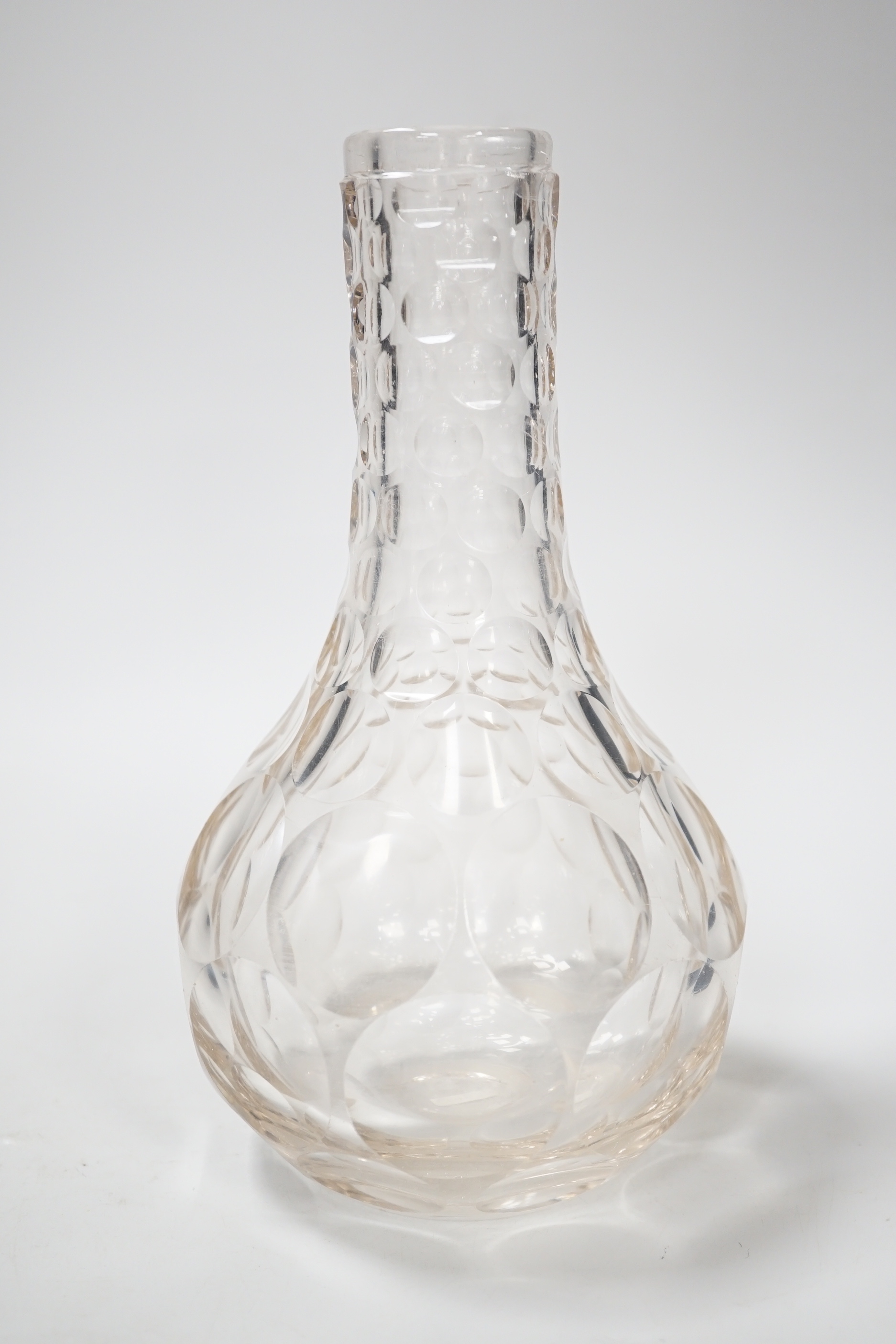 An English lead crystal shaft and globe carafe, decorated throughout with cut roundels or printies, grey dark coloured metal. early 19th century, 23cm high